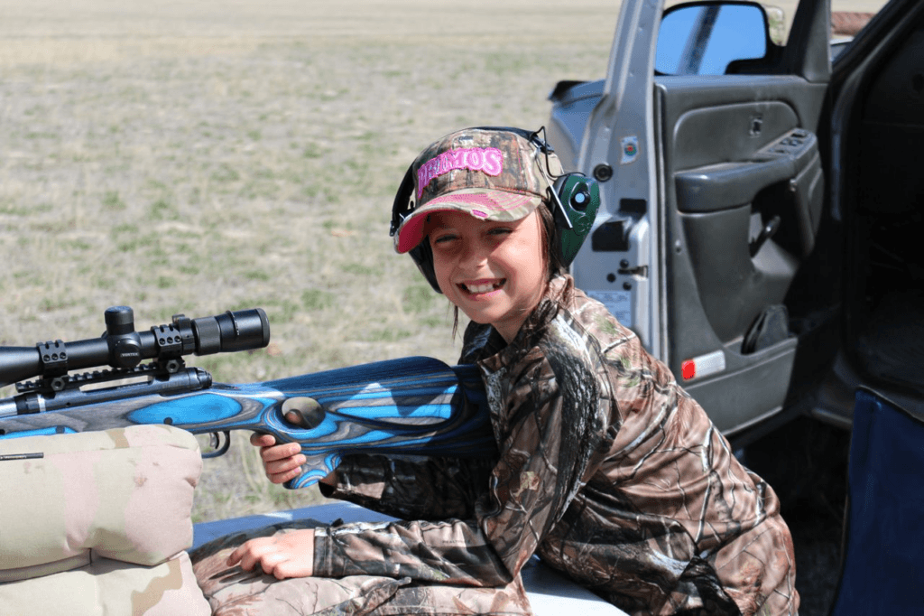 Child learning to shoot