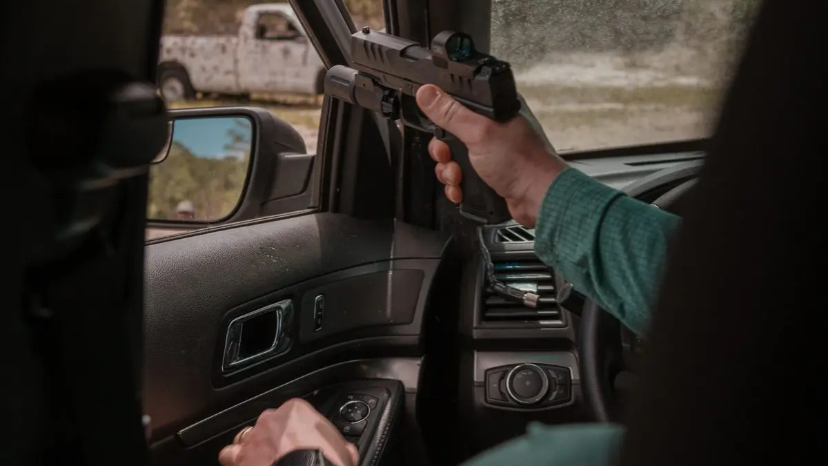 Defensive firearm training in a vehicle