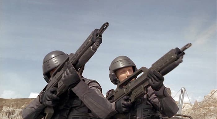 Johnny Rico and Ace Levy aim their Morita Mk1 rifles