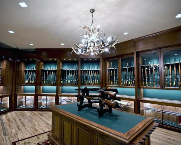 Room full of firearm display cabinets.