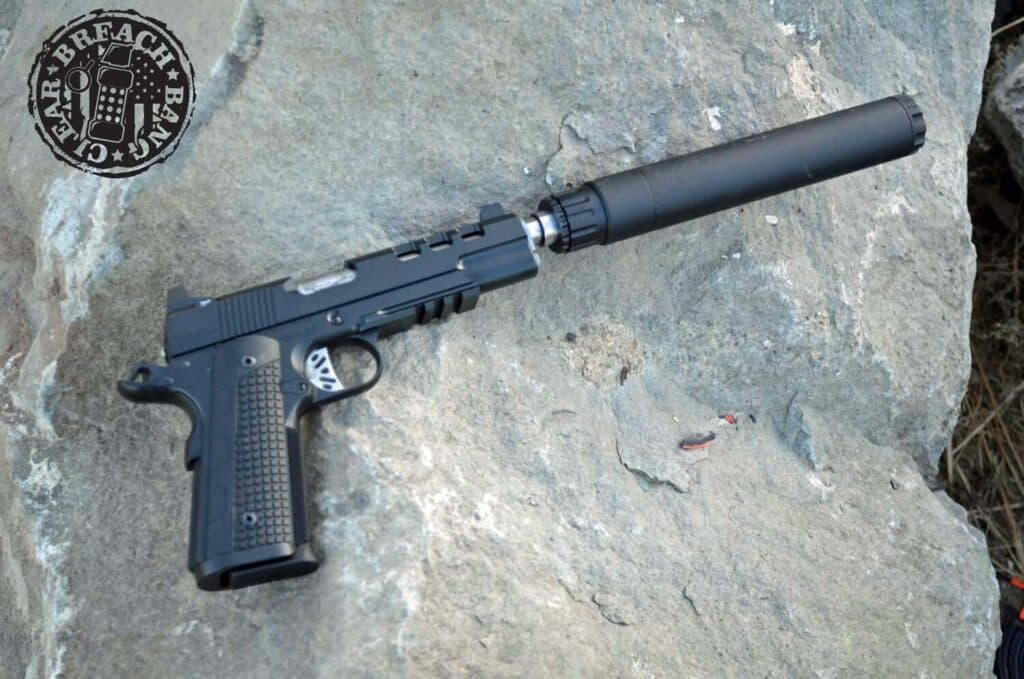 Dan Wesson Discretion Commander with a suppressor Breach Bang Clear