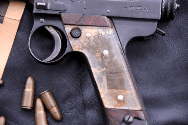 Sweetheart grip on a captured Japanese Nambu pistol