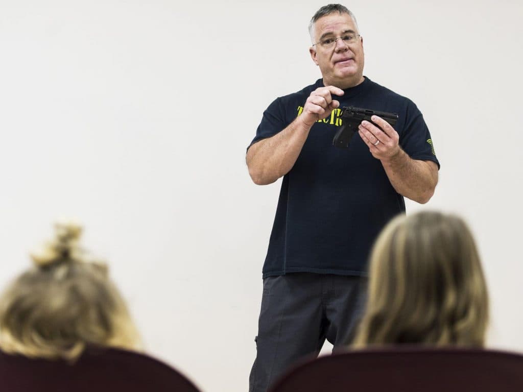 Marko Galbreath teaching firearms safety to kids