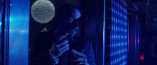John Wick reloads the P30L at the night club