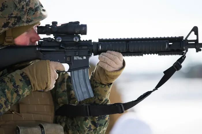 Marine firing an M16A4