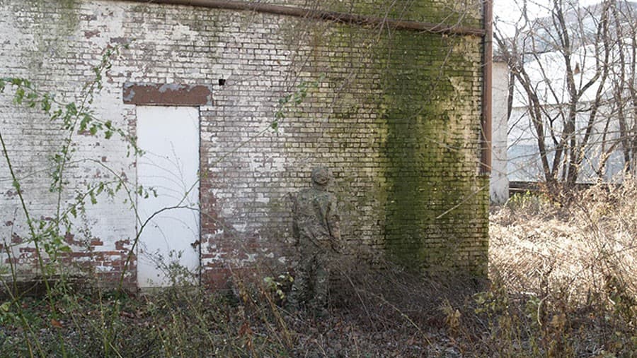 MultiCam camo against brick wall