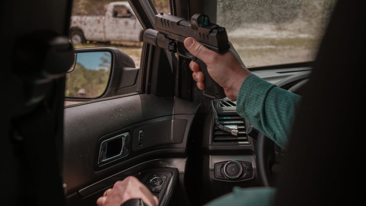 Defensive firearm training in a vehicle