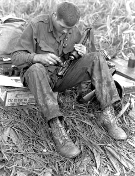 Soldier Cleaning His Rifle