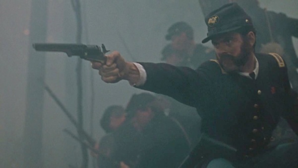 Thomas Chamberlain (C. Thomas Howell) fires his Colt 1851 Navy revolver.