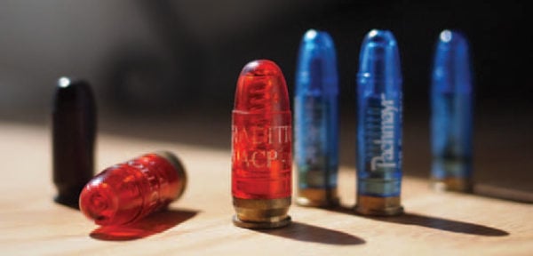 Dry Fire Training on a white background, Fake bullets made from red plastic  are used for shooting practice Stock Photo - Alamy