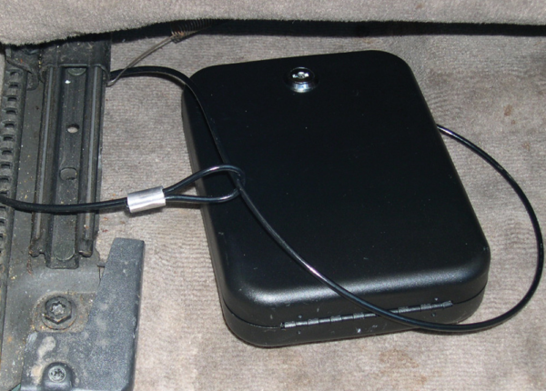 Gun safe locked onto car seat