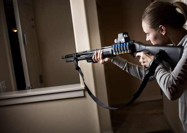 Woman defending home with shotgun