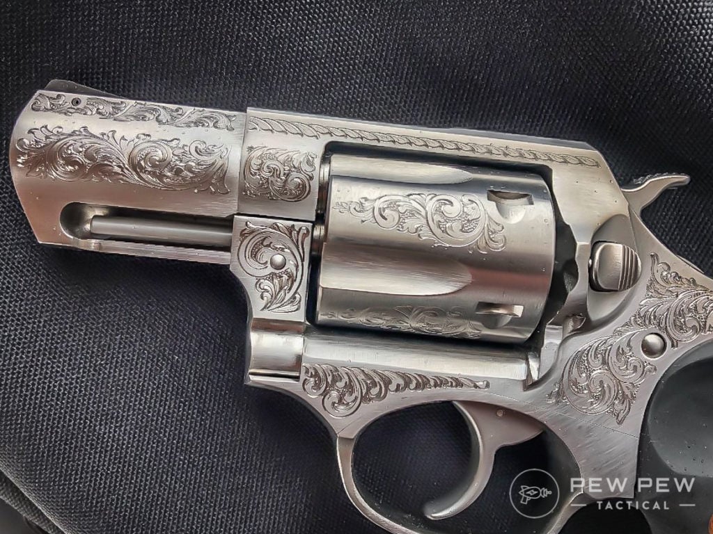 The engraving work on this pistol is beautiful, also, note the shrouded ejection rod