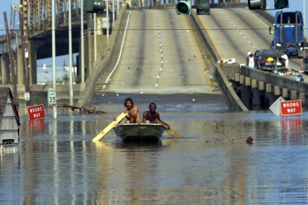 Residents boat on the highway during Katrina
