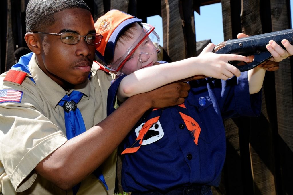 Cub Scout shooting a BB gun