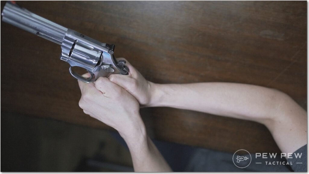 Revolver Thumb Tucked Position