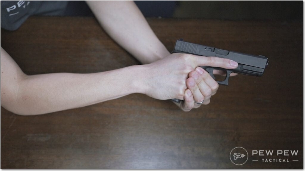 Handgun Grip Wrapping Around Knuckles