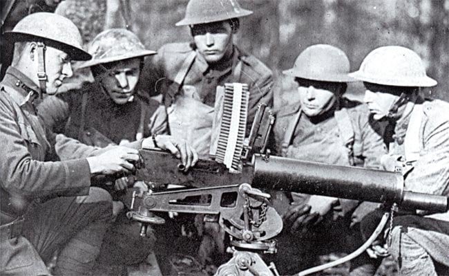 Lt. Val Browning (left), son of firearm inventor John Moses Browning, instructing US soldiers on how to use the M1917 machine gun his father invented. (France, 1918)