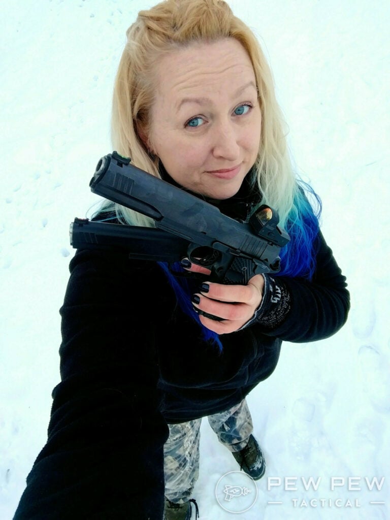 Kat with a full-size pistol