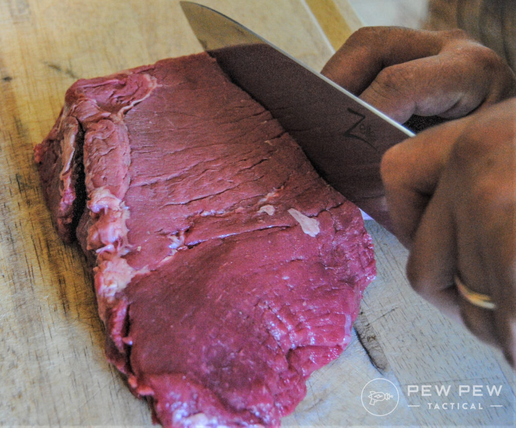 Cutting meat against the grain for tender jerky