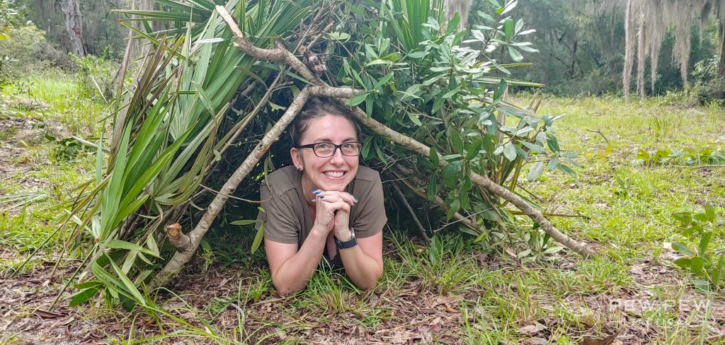 Bushcrafting Completed Shelter with person