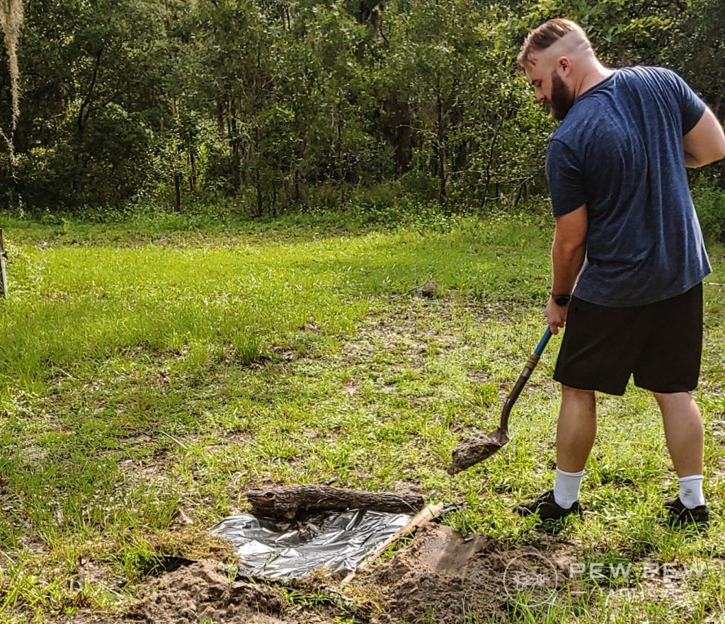 Bushcrafting Pinning Solar Still Corners