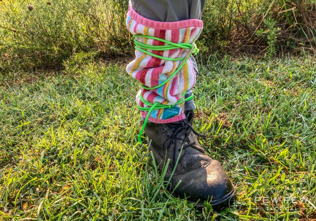 Man's lower leg with a dishrag tied around it