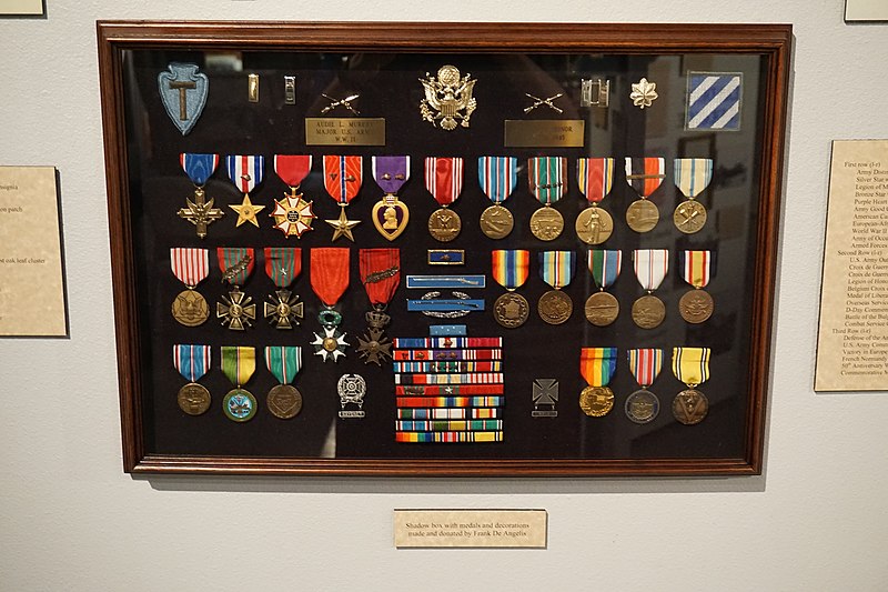 A shadow box displaying Audie Murphy's medals and decorations, among other memorabilia