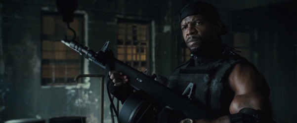 Terry Crews as HaQle Ceasar shoots his AA-12 in The Expendables 2