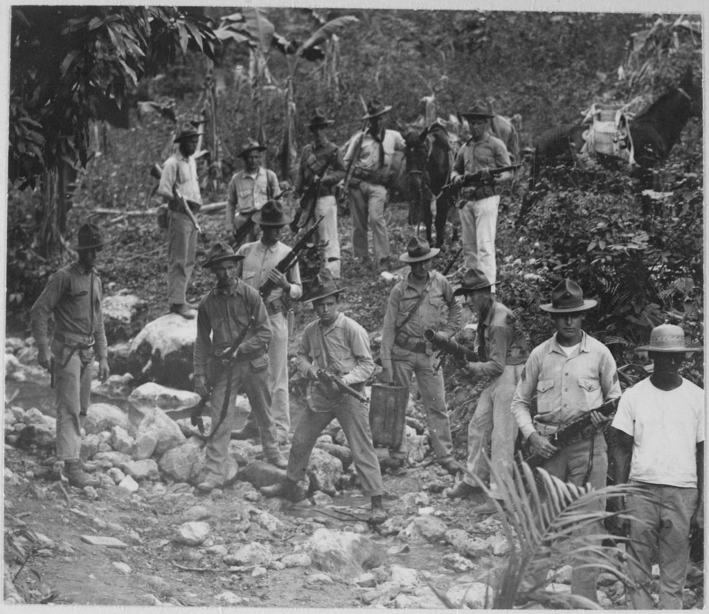 U.S. Marines and guide in search of bandits. Haiti, circa 1919 (Photo: U.S. National Archives and Records Administration)