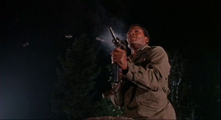 Jefferson (Jim Brown) fires at a German Sniper