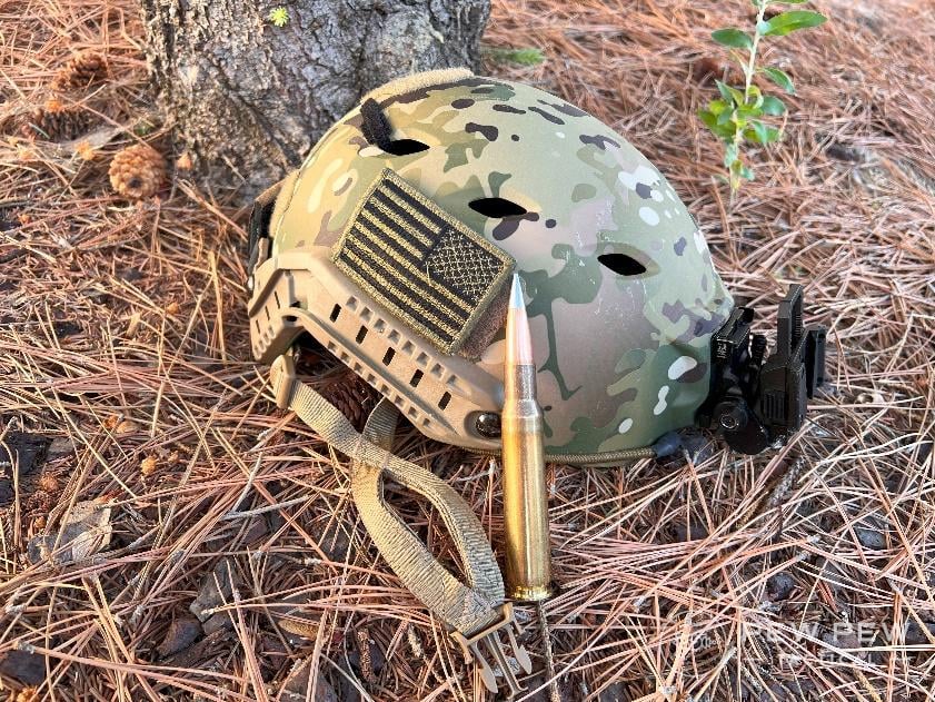 .50 BMG next to ballistic helmet