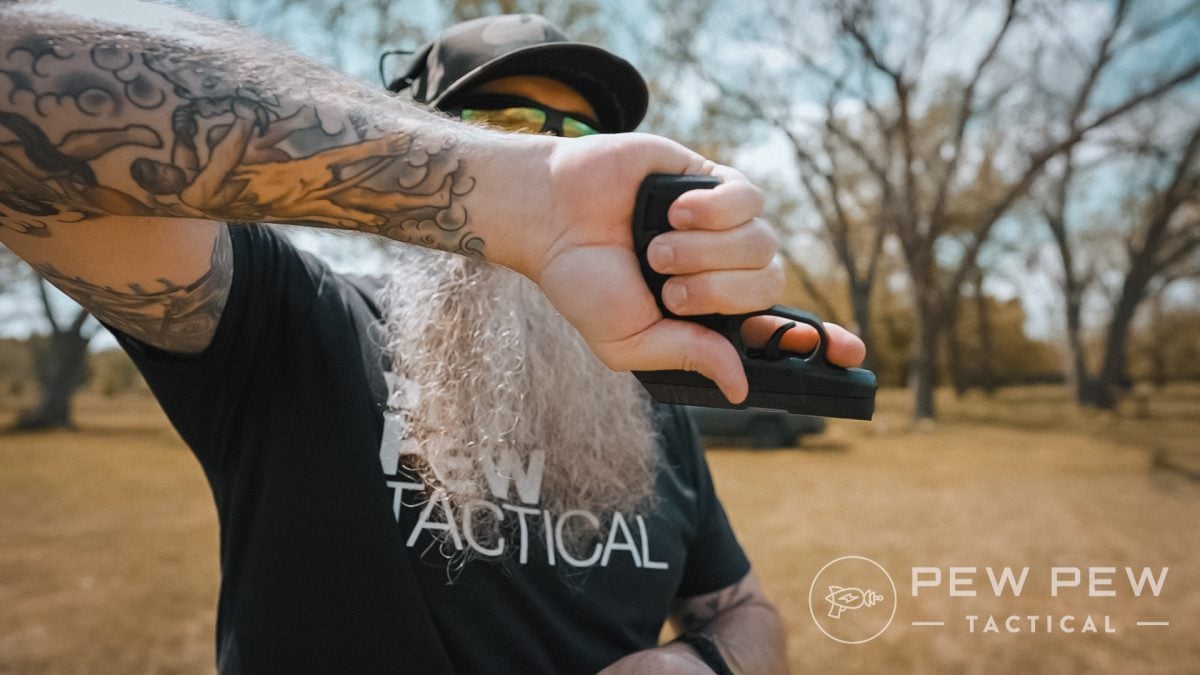 Sean holding the KelTec P32 with extended mag