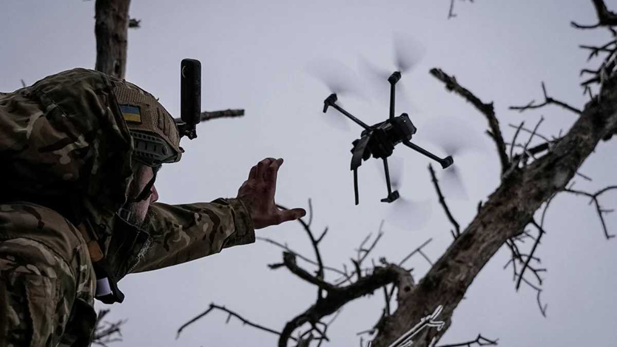 Ukrainian Soldier releasing a drone
